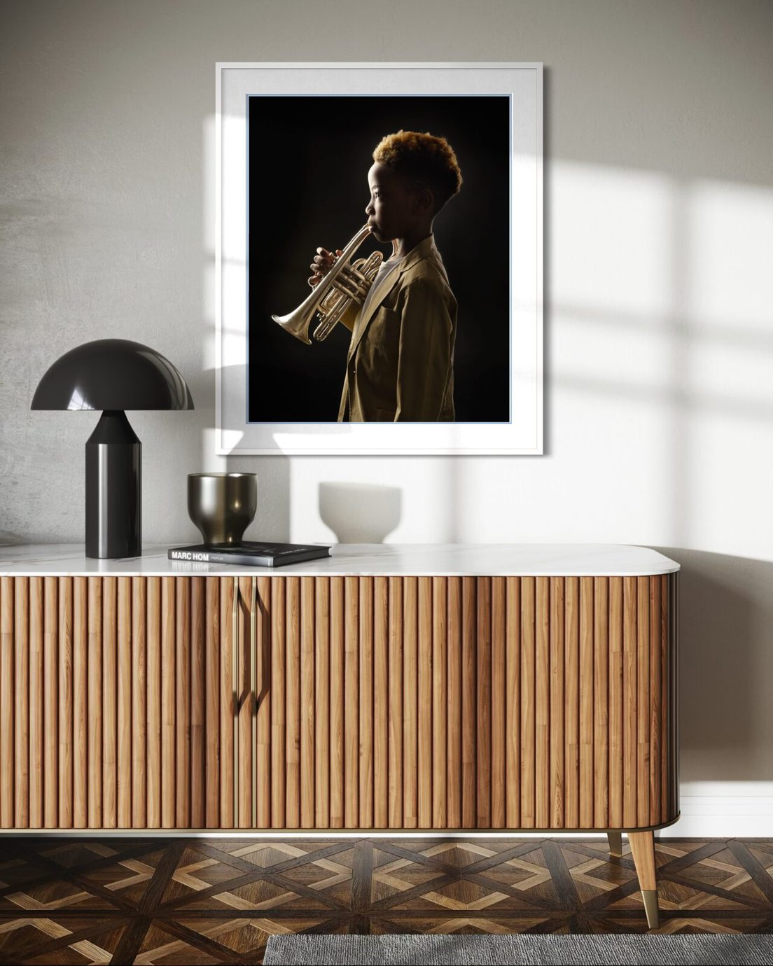 Framed portrait above a fluted sideboard in morning light